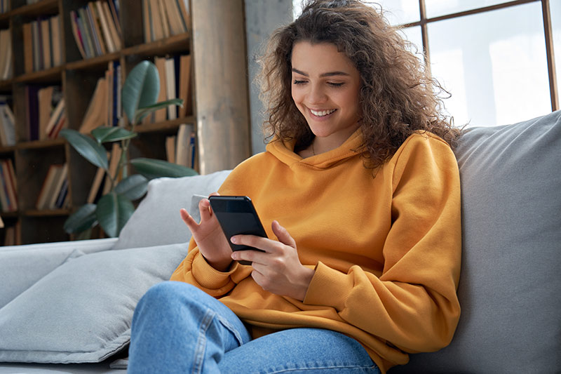 Teen girl checking mobile phone