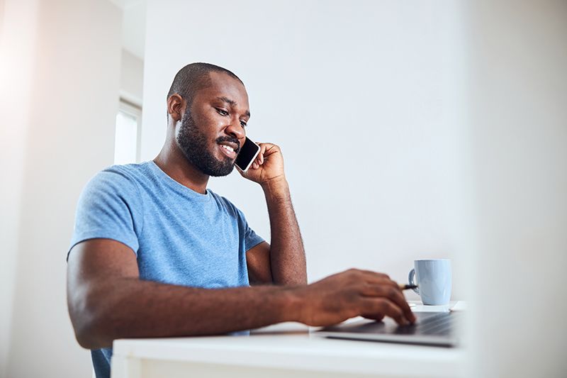 middleaged adult moving his hand on a laptop